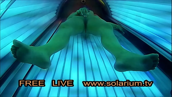 Beautiful girl with nice big breasts masturbates under the www.solarium.tv