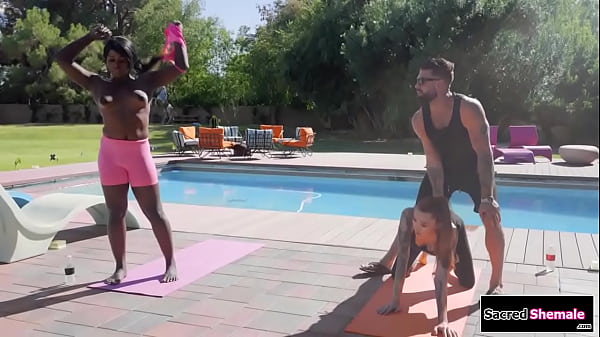 Ebony ts Ana Andrews and asian tgirl Billie Beaumont share their yoga instructor in 3some.He sucks their cocks and then the black tranny barebacks him 