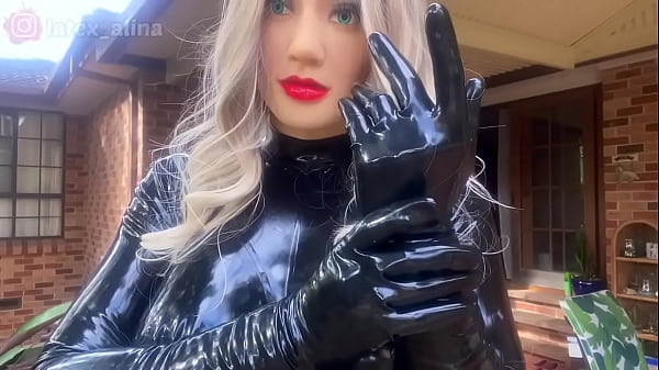 Rubber Doll In Latex Suit And Latex Gloves thumbnail