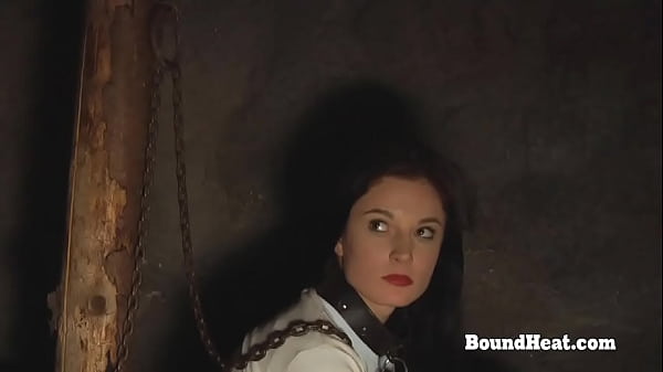 Redhead lesbian slave in bondage gets whipped by dominant mistress 