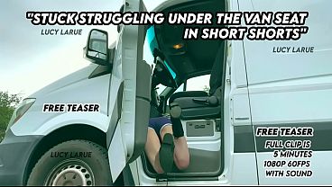 Stuck struggling under the van seat in short shorts