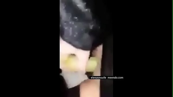 Masturbating with a banana in the outdoor 