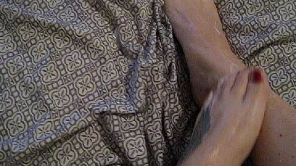 FOOT FETISH - rubbing lotion on sexy feet close up - kinksterparadise.com 