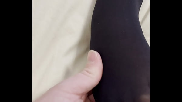 Boy rubs my feet in my new stockings 