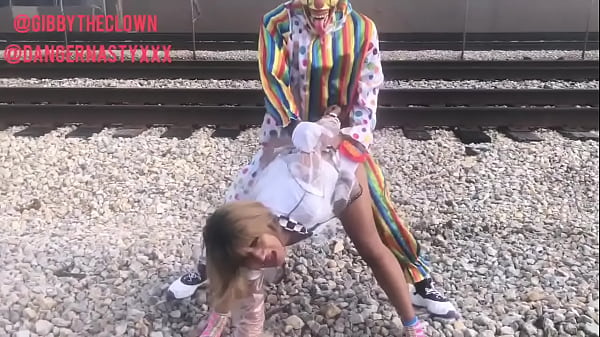 Clown fucks girl on train tracks