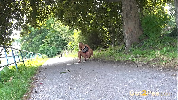 Got2pee Brings Another Desperately Peeing Girl In Powerful Piss - Featuring Big Puddle thumbnail