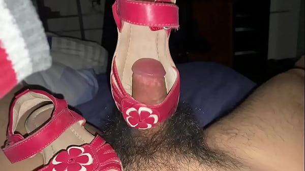 Playing penis push-up with sandal