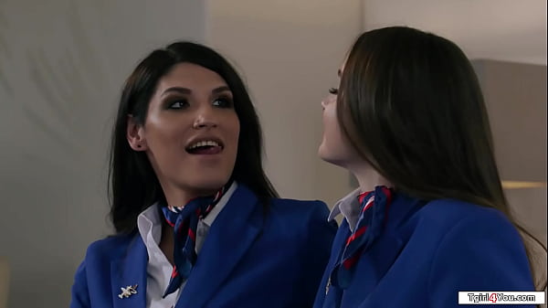 Shemale flight attendant Zariah Aura and her busty colleague Hazel Moore stay the night.The latin tgirl licks and fucks the brunettes hairy pussy 