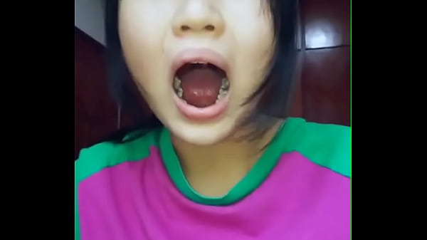 Chinese Girl Showing The Inside Of Her Mouth thumbnail