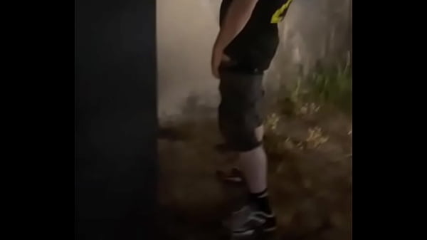 Helping him pee in the street