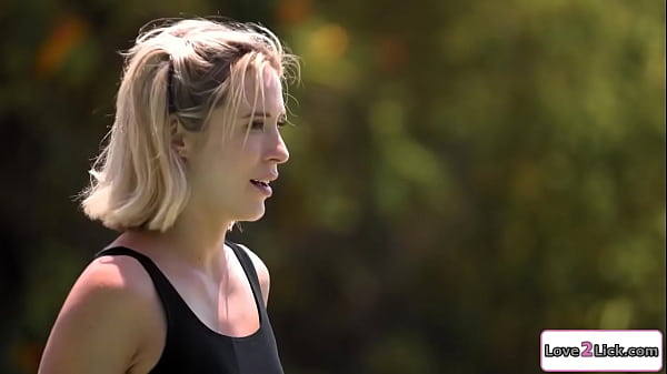 Swimming instructor licks blonde outdoors