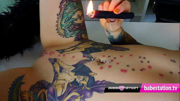 British alternative babe with tattoos uses candle wax 