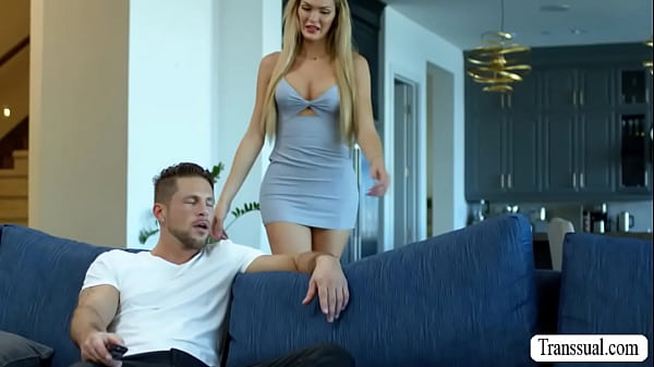 Roman Todd and Tgirl blonde Tori Easton are on the couch kissing each other passionately 