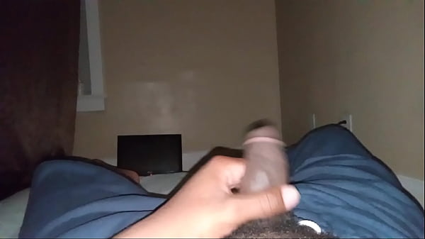 In bed massaging my cock while it's dry pt1
