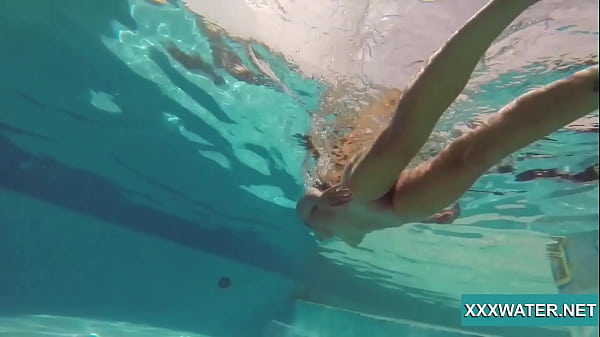 Sexy Candy swims and strips nude underwater